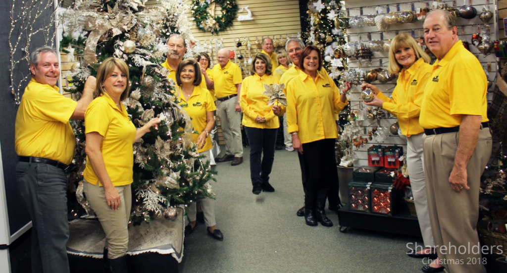 2018: Shareholders pose for a photo in our Theme Tree area.